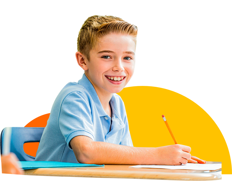 School student at his desk writing